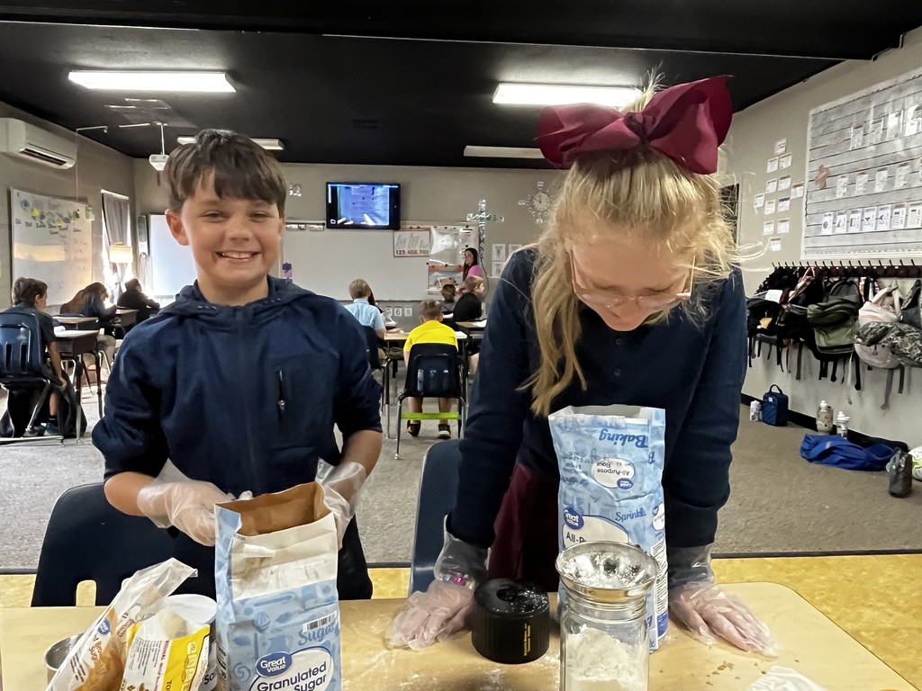 4th graders getting ready to add sugar to the cookie mix