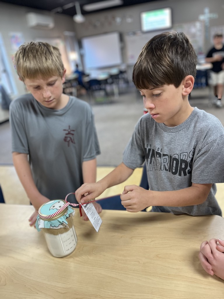 4th graders observing their cookie mix for the auction