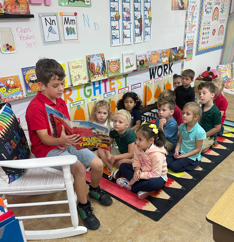 5th grade students reading to Outback