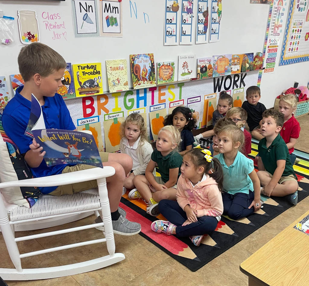 5th grade students reading to Outback