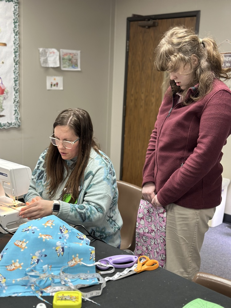 Geometry girls learning how to sew 