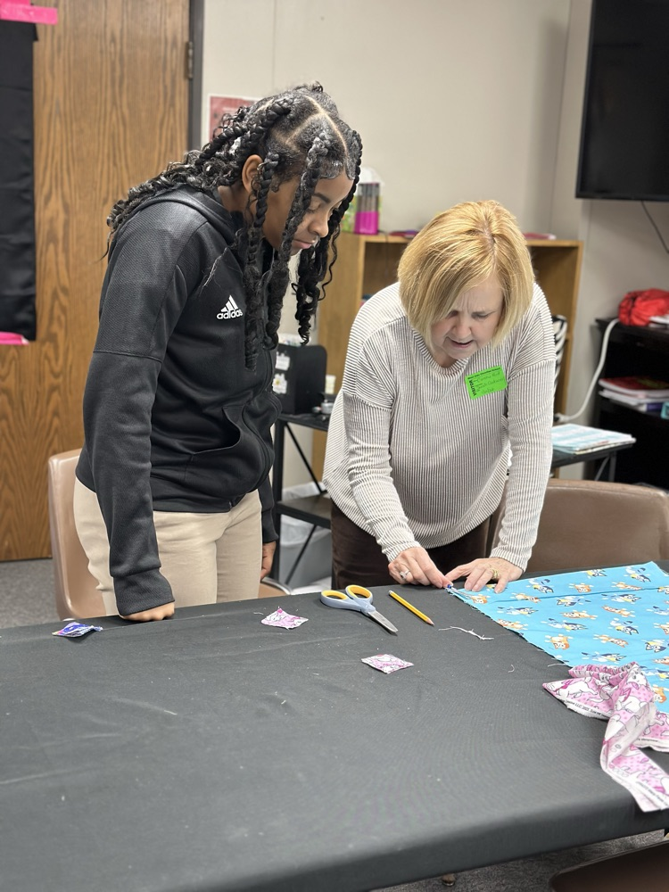 Geometry girls learning how to sew 