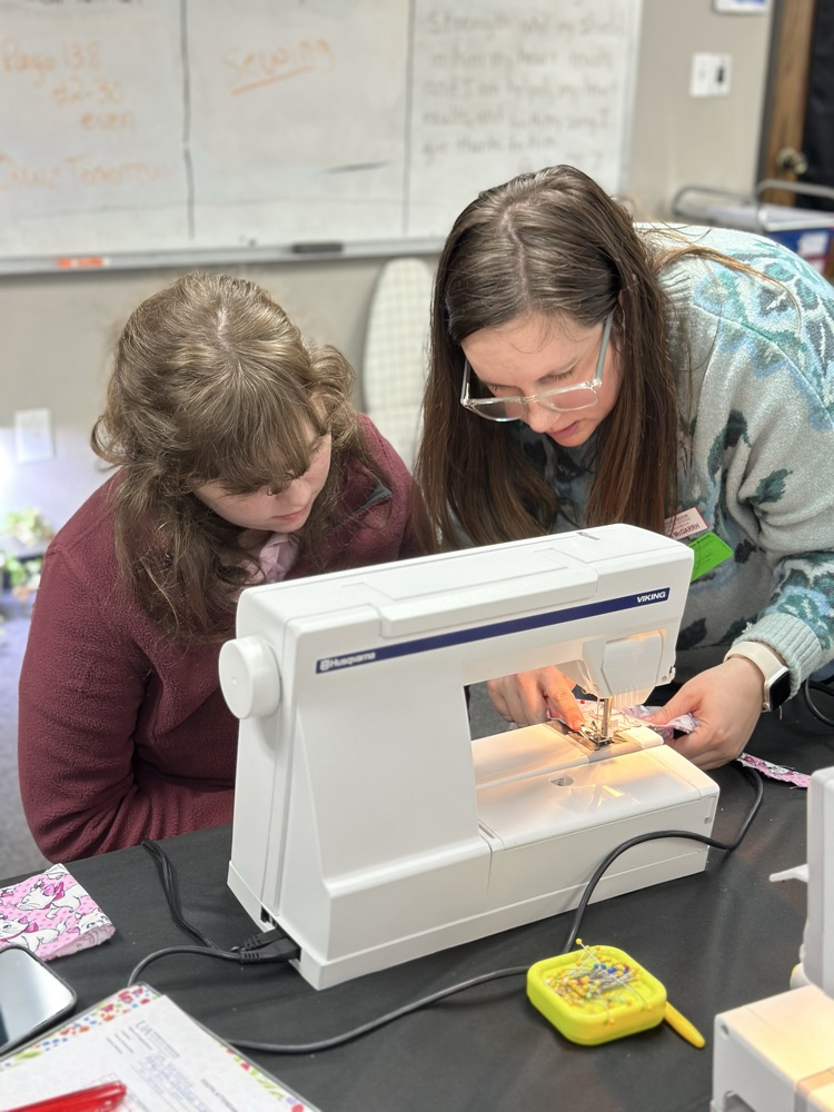 Geometry girls learning how to sew 