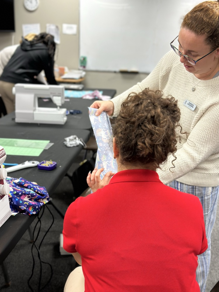 Geometry girls learning how to sew 
