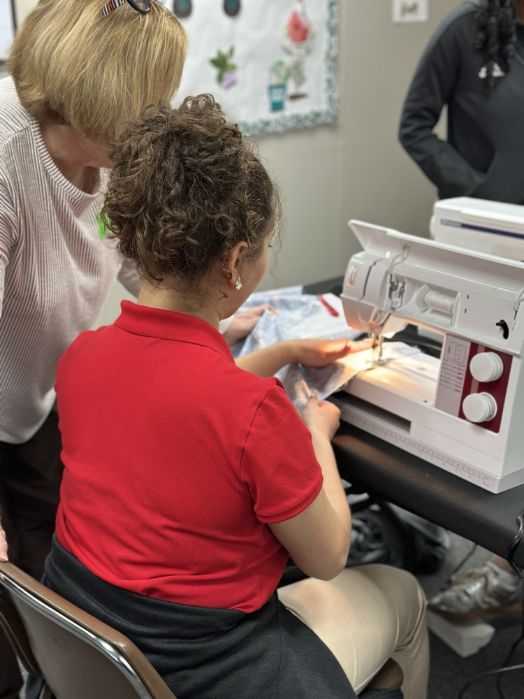 Geometry girls learning how to sew 