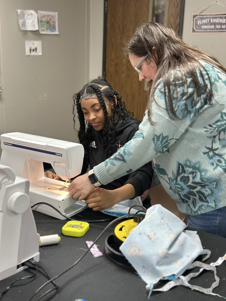 Geometry girls learning how to sew 