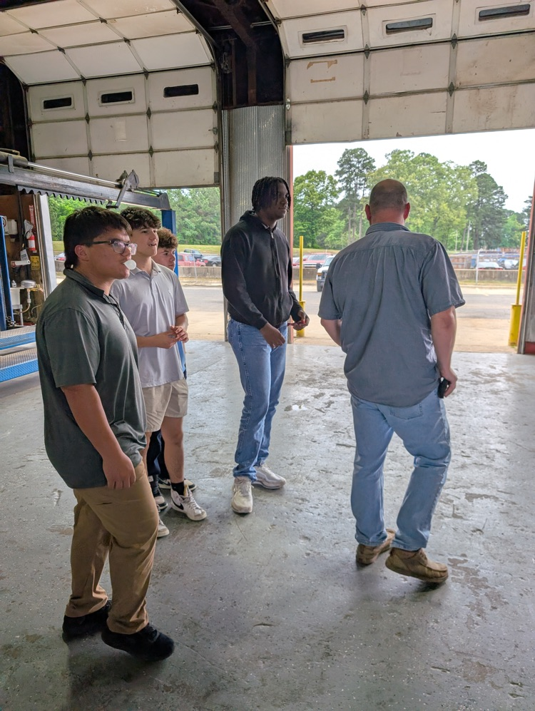 High school students visiting various businesses