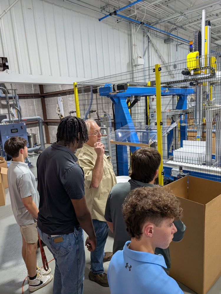 High school students visiting various businesses