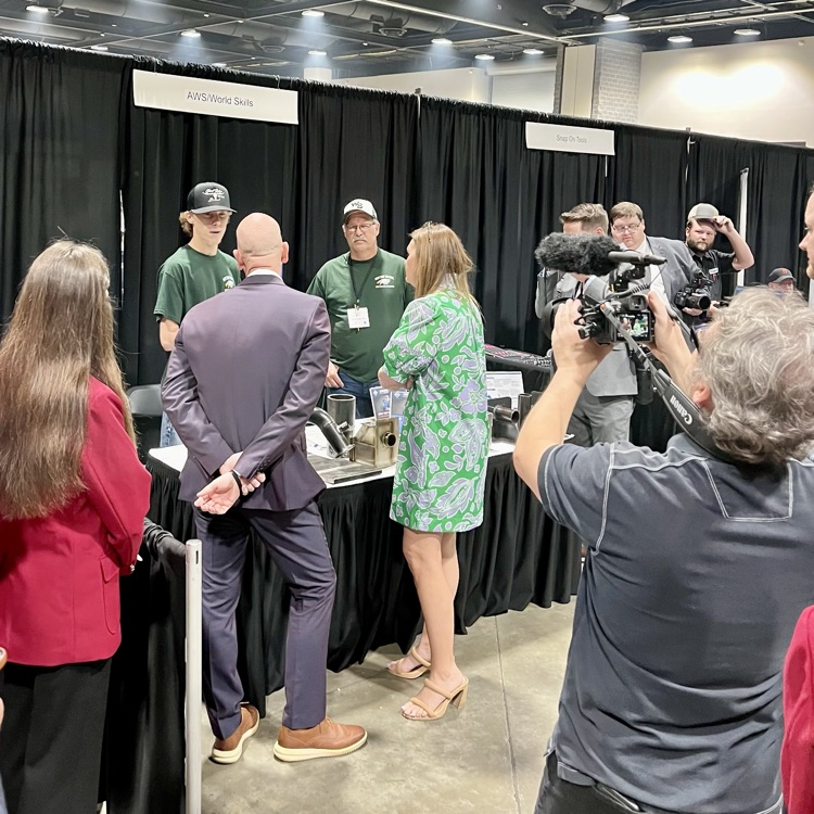 Gov. Sanders meets champion welder CJ Parks at SkillsUSA competition.