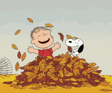 Peanuts characters, Linus and Snoopy, sitting in a pile of fallen leaves