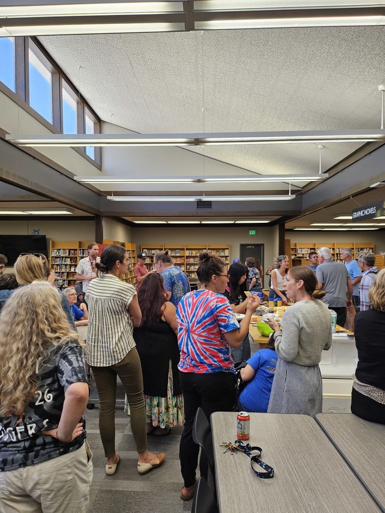 Staff gathered in the libary