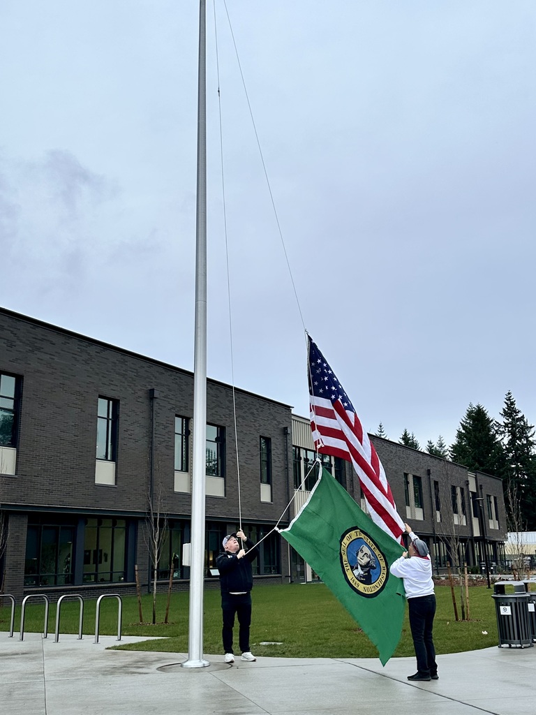 Ryan and Loretta preparing to raise the flags
