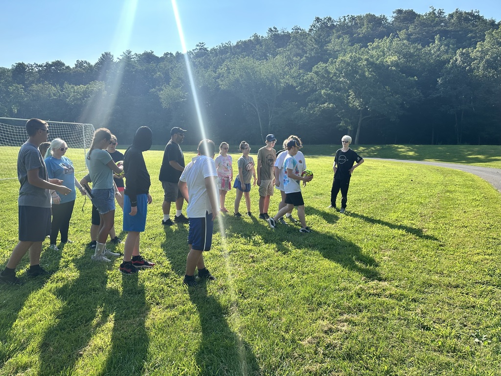 Camp participants participating in an activity outside. 