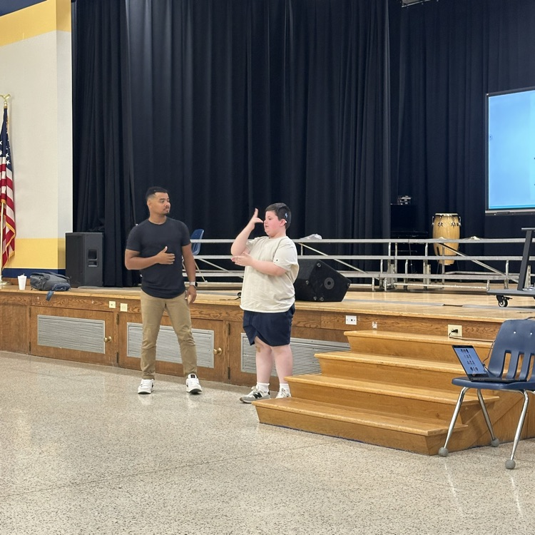 Justin Perez watches a male student as the student acts out emotions.