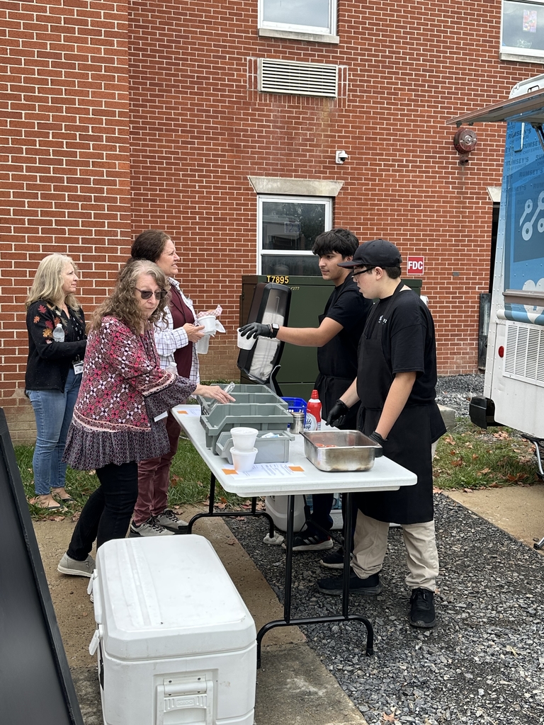 Conference attendees ordering their meals from CTE students outside of the food truck.