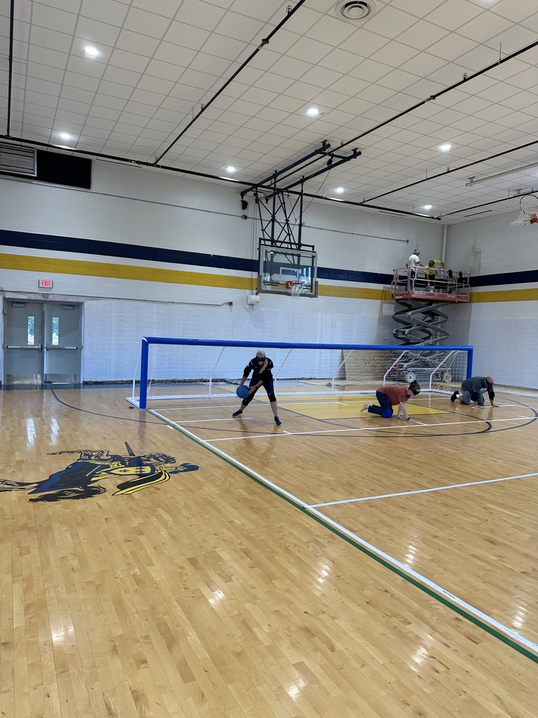 VI conference attendees learning how to play goalball.