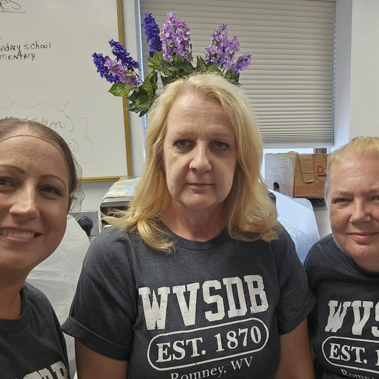 Group photo of three female kitchen staff members.