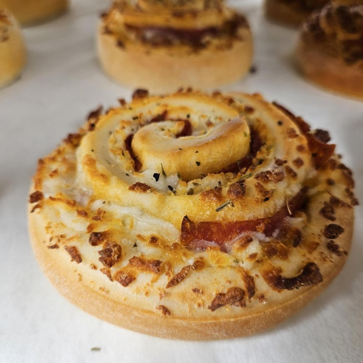 Up-close photo of a a pastry on a baking tray.
