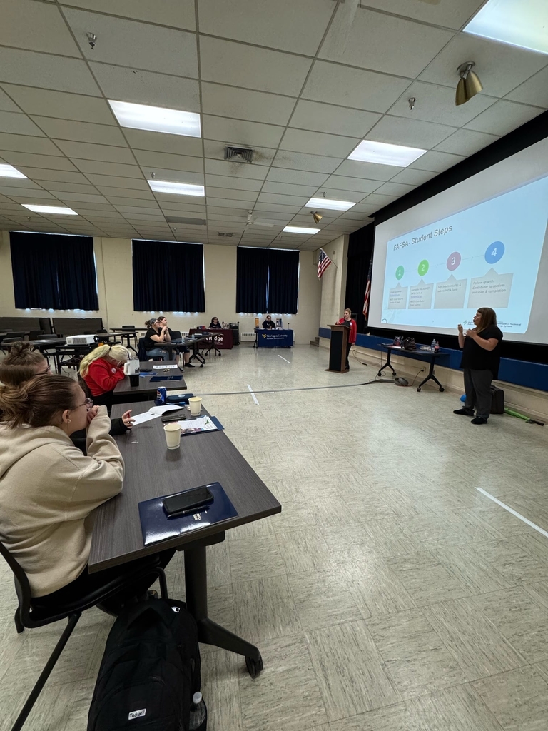 Participants observe a presentation on "FASFA."