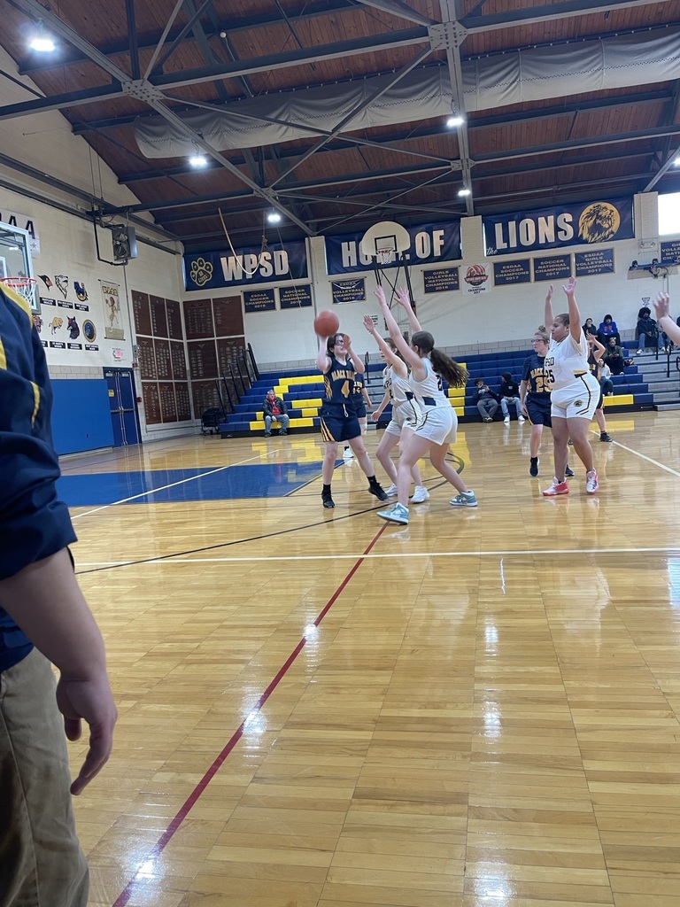 Girls' basketball team playing on the court against WPSD.
