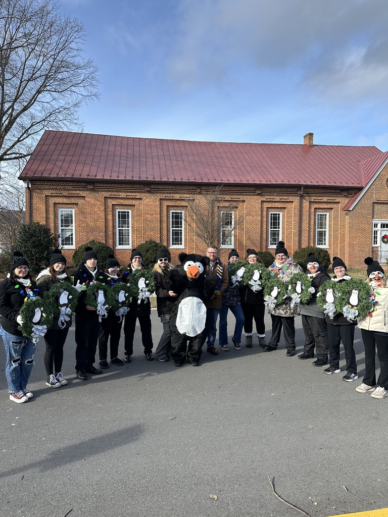 A group photo of students standing side by side with the WVSDB Black Bear mascot in the center along with Superintendent Burch.