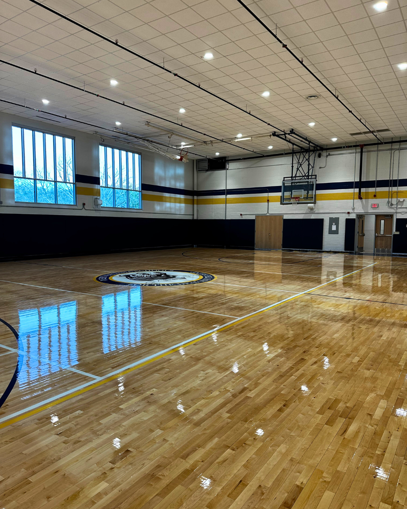 An overview of the gymnasium with the new logo and flooring. 