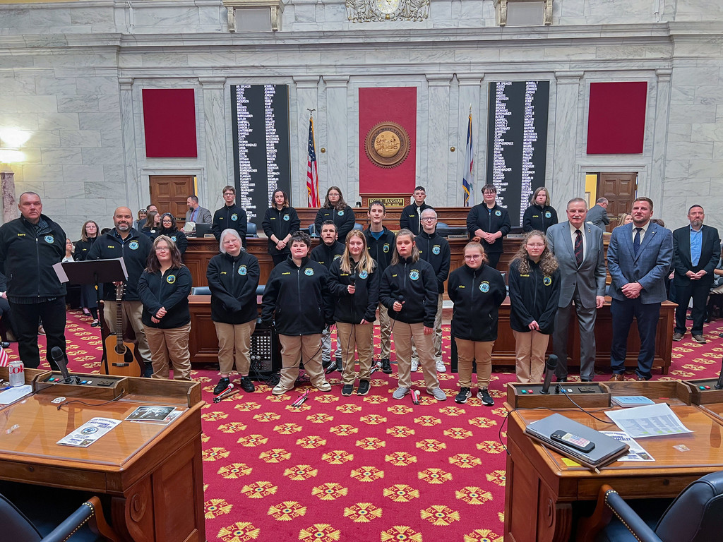 WVSDB students pose for a photo on the Legislature floor with Mr. Nealis, Mr. Cannon, and Delegate Hillenbrand. 