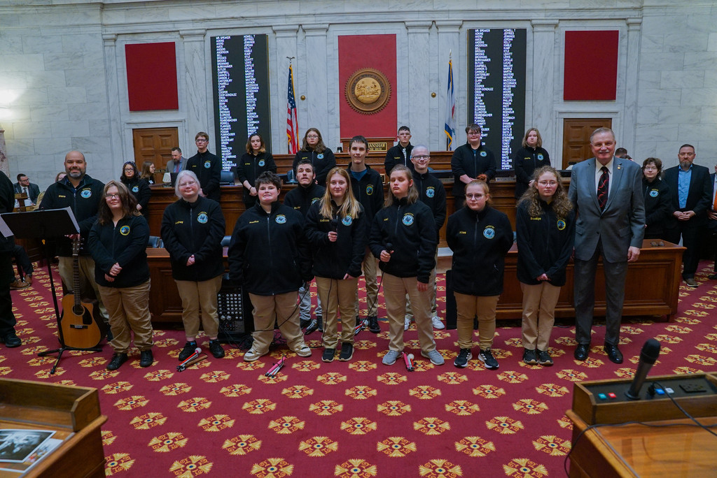 WVSDB students pose for a photo on the Legislature floor with Delegate Hillenbrand. 