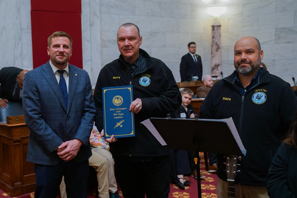 Tapestry Directors, Mr. Nealis and Mr. Haza pose with Mr. Cannon as they have accepted a certificate of achievement from Mr. Cannon. 