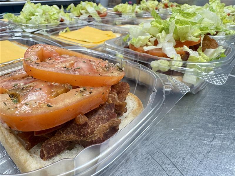 Bacon, Lettuce, Tomato, and Cheese on a Ciabatta Bun.