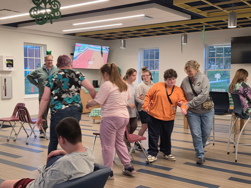 Students participating in a game of musical chairs.