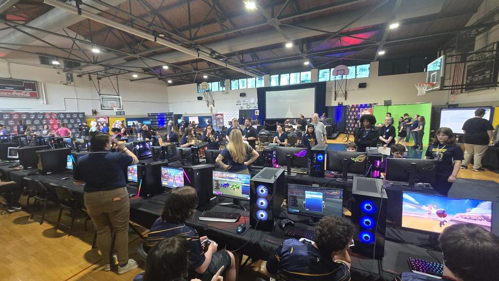 Overview photo of the Esports tournament with players seated at their computer stations.