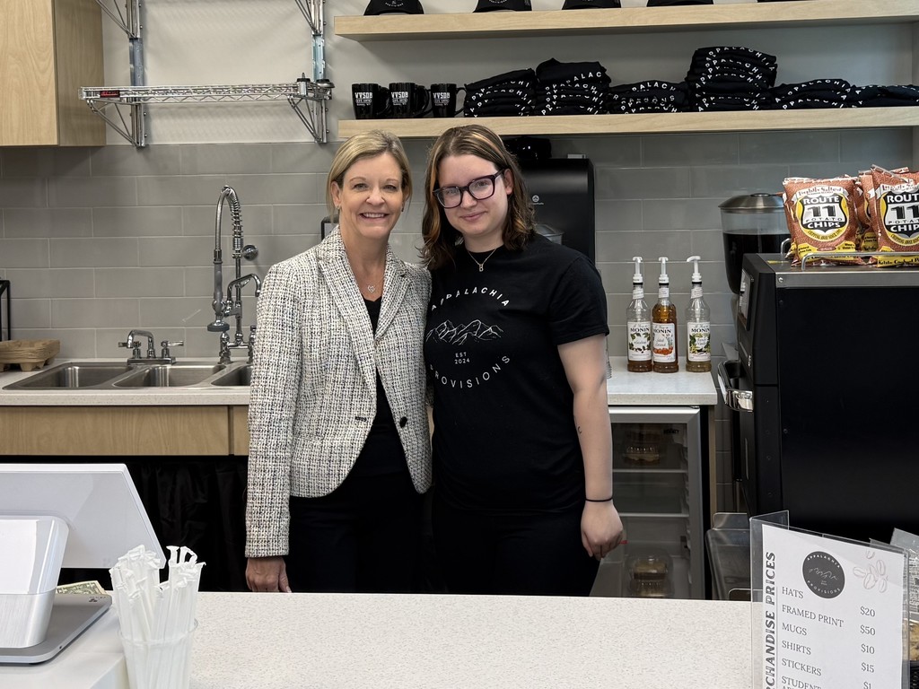 Superintendent Michele Blatt stands beside a female student, Bindi in the Appalachia Provisions Café.