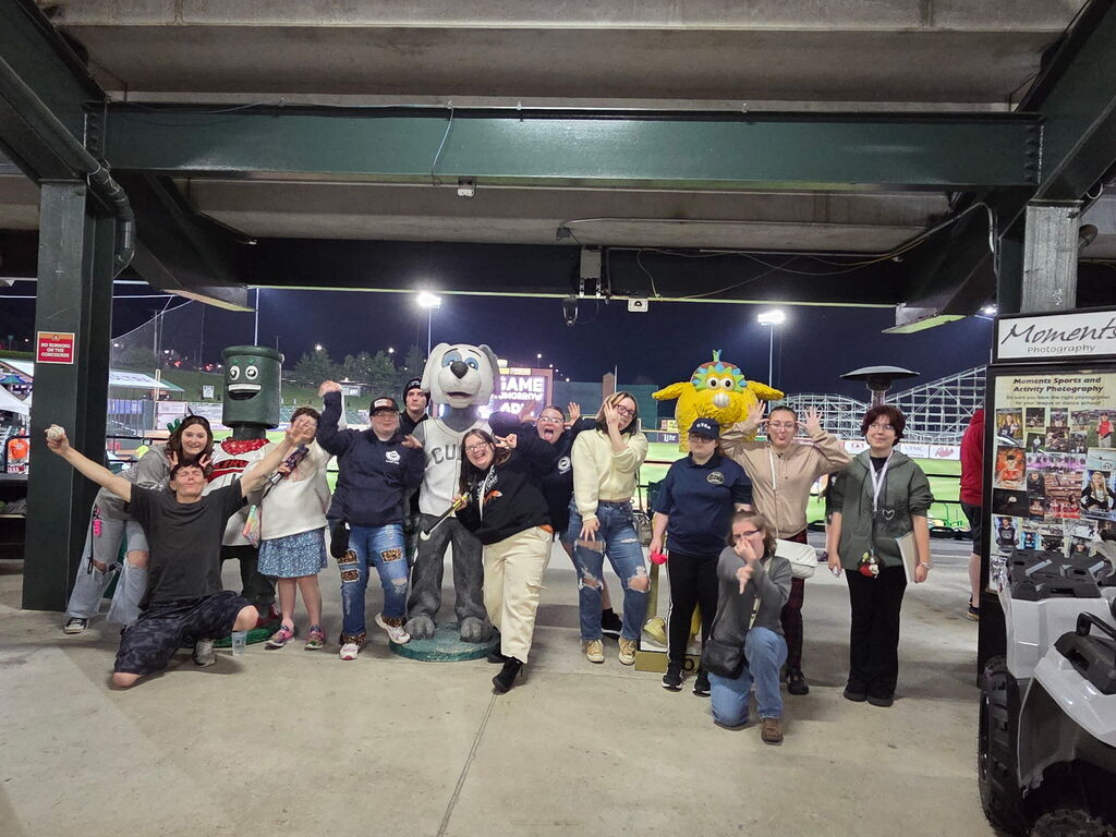 WVSDB students pose silly with Altoona Curve mascots. The baseball park is in the background.