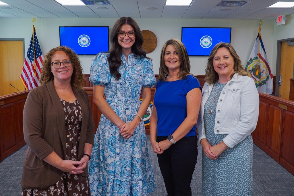 Mrs. JoAnna Gilbert stands on the far left-hand side along three other female finalists.