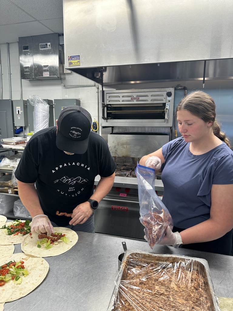 Chef Brian Olden and Candace work together to assemble the BBQ, Bacon, and Blue Chicken Wraps.