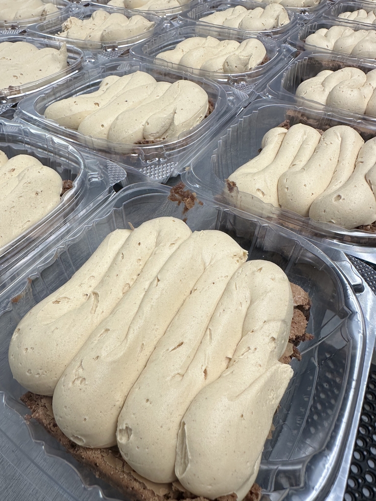 Freshly made peanut butter brownies topped with a thick layer of peanut butter frosting, packaged and ready for sale at Appalachia Provisions Café.