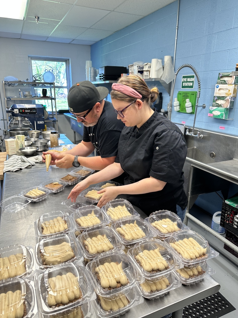 Chef Olden and a female culinary student prepare and package freshly made peanut butter brownies in the Appalachia Provisions Café kitchen.