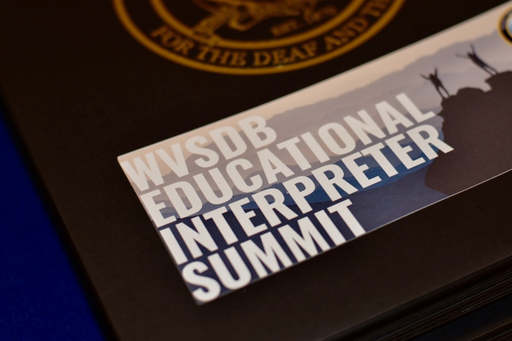 Close-up of a printed card reading “WVSDB Educational Interpreter Summit” displayed at the event.