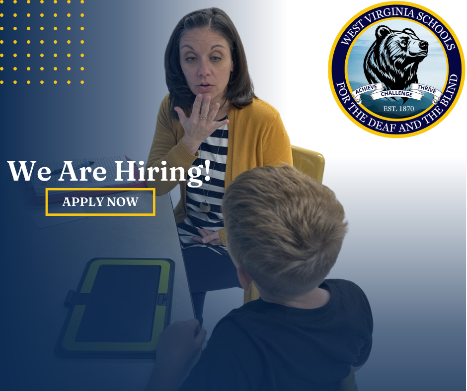 teacher signing with student with bear logo and we are hiring apply now banner