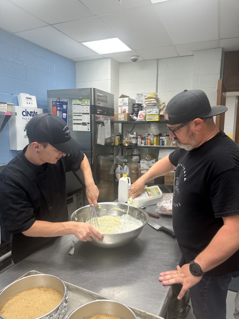 Appalachia Provisions student and instructor work together to mix ingredients in the café kitchen.