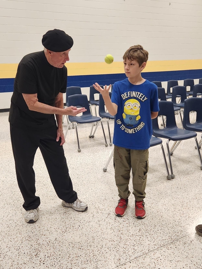 Deaf Mime JJ Jones watches as a WVSDB student tosses a tennis ball into the air during an interactive activity.