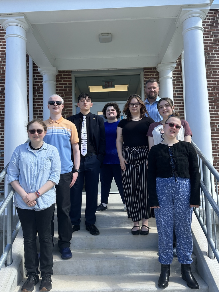 Group photo of eight WVSDB students and Superintendent Burch standing together on the steps outside a brick campus building for the new Superintendent’s Student Council.