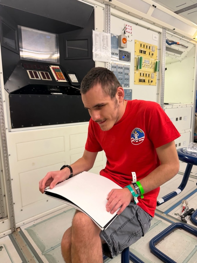 A WVSDB student explores tactile materials during a hands-on Space Camp activity.