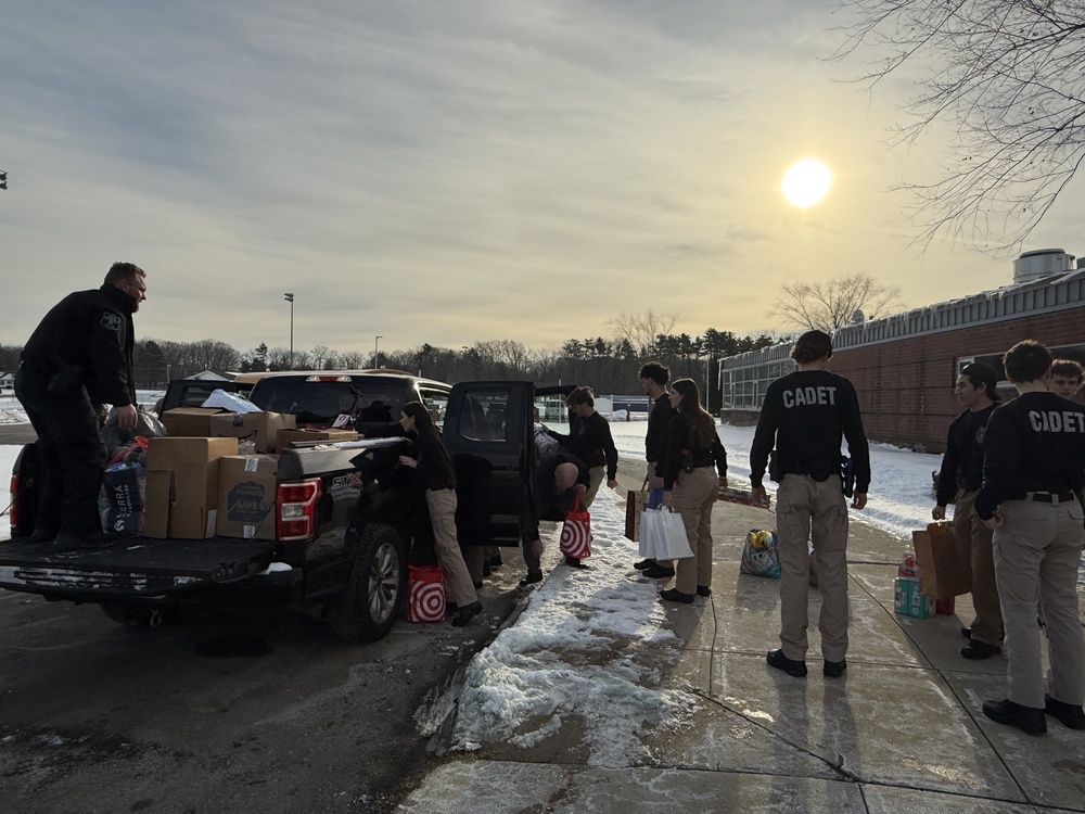 Criminal Justice Students/Officer Doucette loading the donations