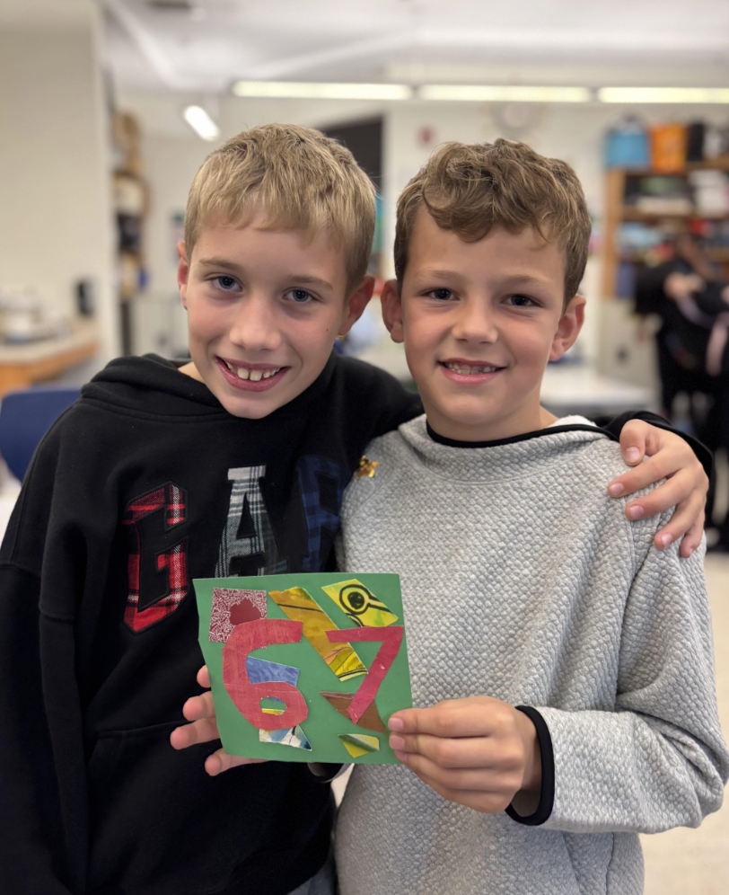 Kids holding 67 sign