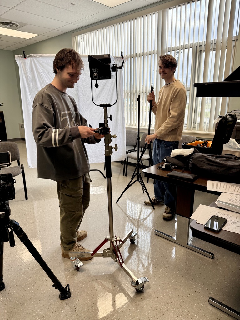 Filmers Emerson and Max setting up for student interviews