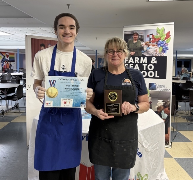 Riley and Ms. Kelly celebrating their victory in the Cooking Challenge!