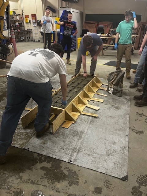 HEO creating a concrete bench