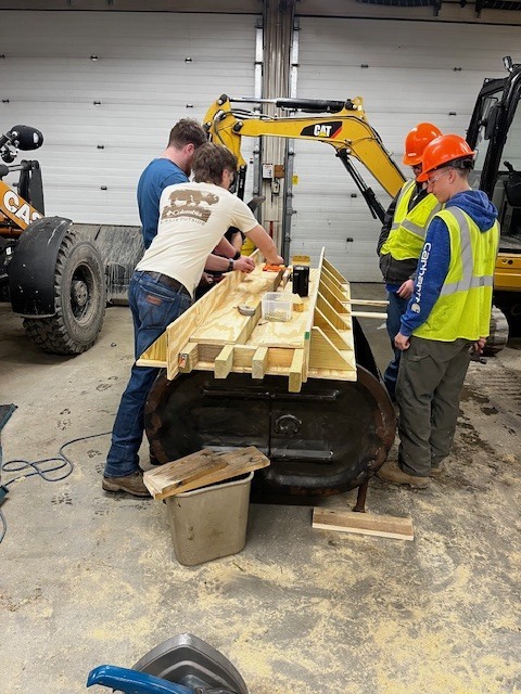 HEO creating a concrete bench